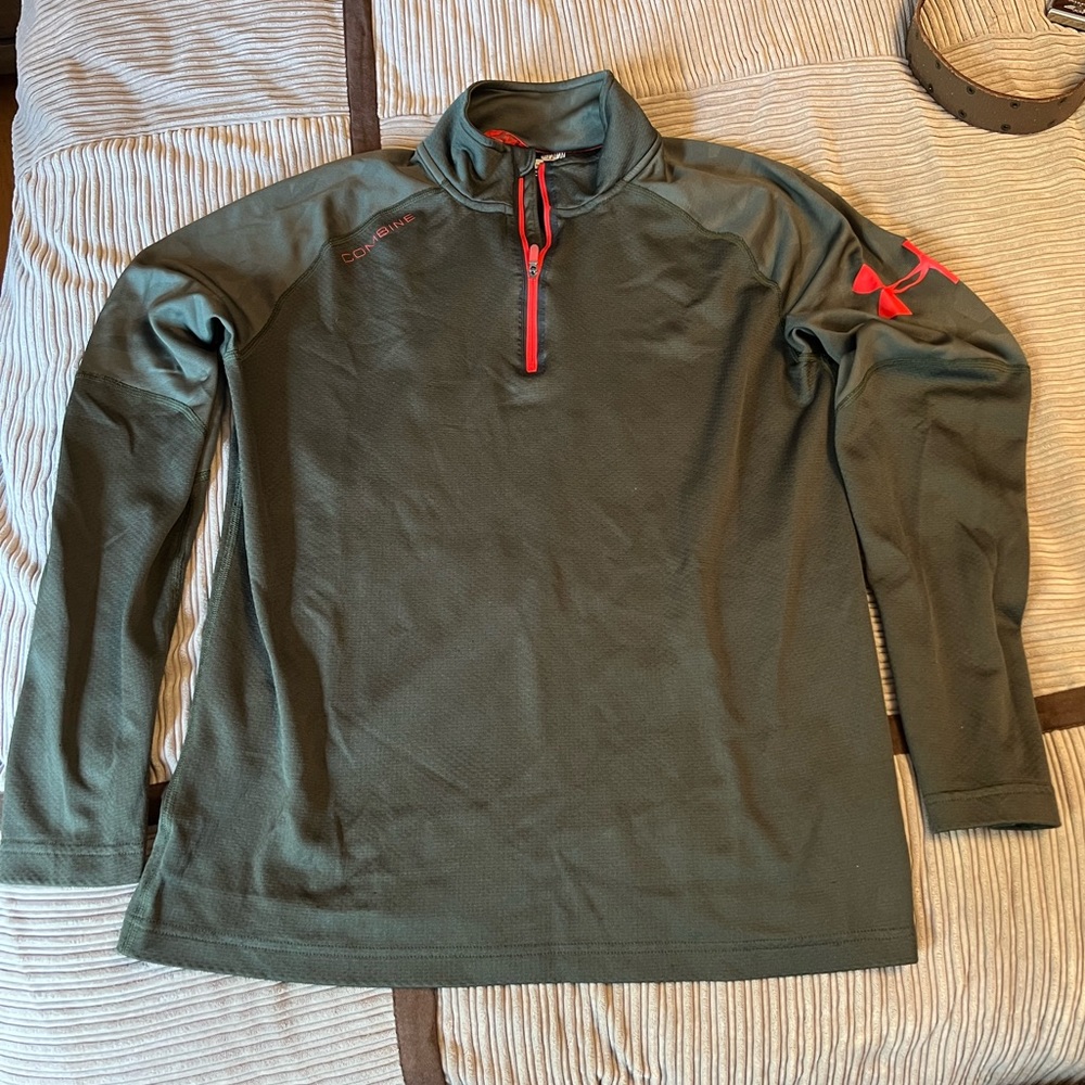 Olive Green Under Armour Combine pullover Medium with camouflage sleeves.
